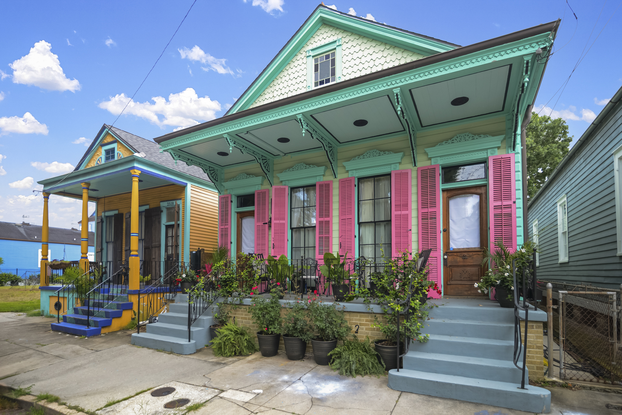 Colorful New Orleans homes with traditional shutters and porches